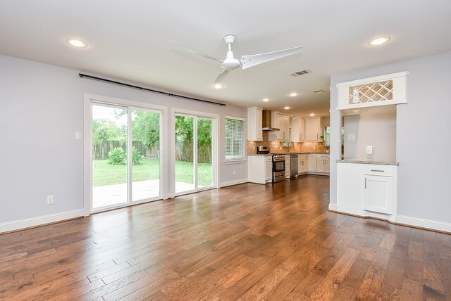 5815 Dryad Dr, Houston, TX 77035 - unfurnished living room with a ceiling fan, dark wood finished floors, and recessed lighting