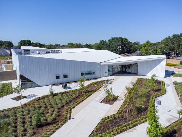 5815 Dryad Dr, Houston, TX 77035 - view of building exterior featuring concrete driveway and a carport