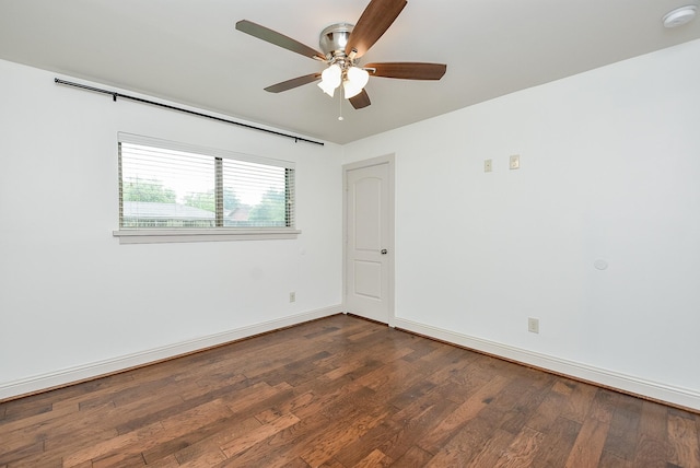 5815 Dryad Dr, Houston, TX 77035 - spare room with a smoke detector, dark wood-type flooring, and a ceiling fan