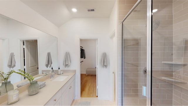 5214 Lake Trout Ln, Baytown, TX 77521 - bathroom with vanity, a shower stall, lofted ceiling, and wood finished floors