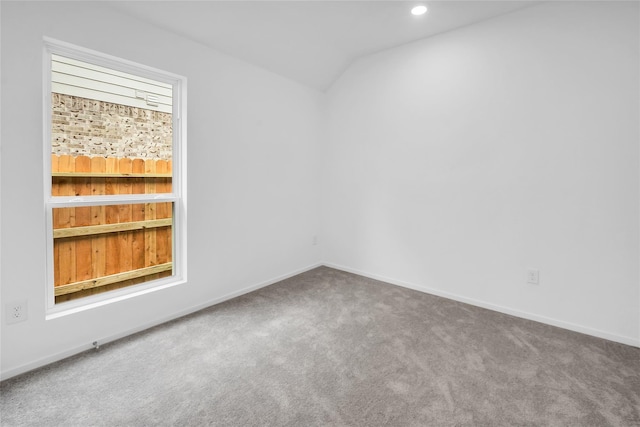 5214 Lake Trout Ln, Baytown, TX 77521 - spare room with carpet flooring, lofted ceiling, and recessed lighting