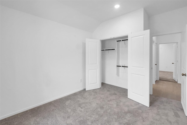 5214 Lake Trout Ln, Baytown, TX 77521 - unfurnished bedroom featuring carpet flooring, vaulted ceiling, a closet, and recessed lighting