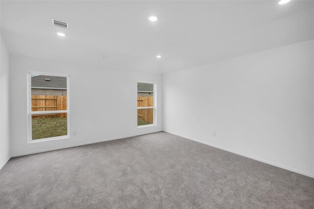 5214 Lake Trout Ln, Baytown, TX 77521 - empty room featuring recessed lighting, carpet, and plenty of natural light