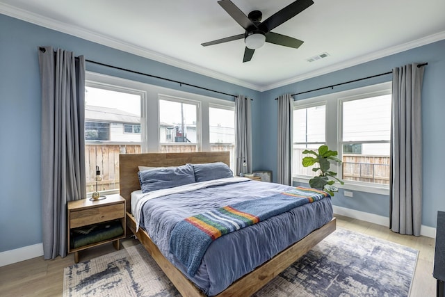 1917 Brun St, Houston, TX 77019 - bedroom with crown molding, light wood-style floors, and ceiling fan