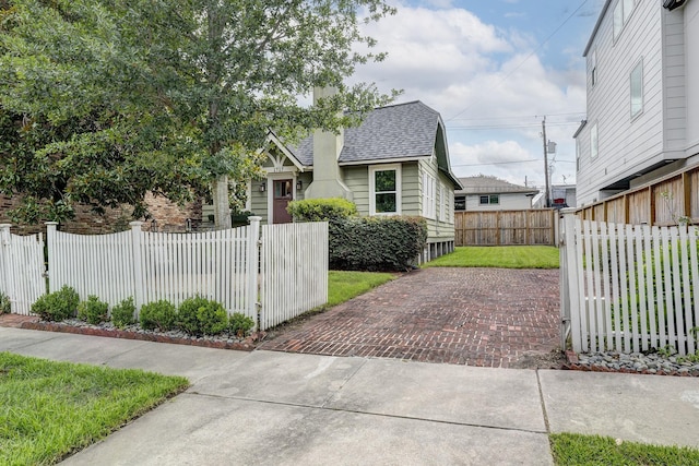 1917 Brun St, Houston, TX 77019 - view of front of house featuring a shingled roof