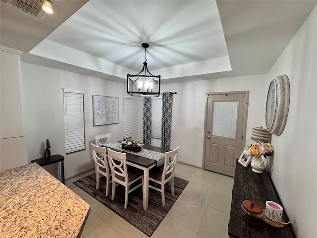 3237 Zircon Dr, Edinburg, TX 78541 - dining area featuring a tray ceiling and a chandelier