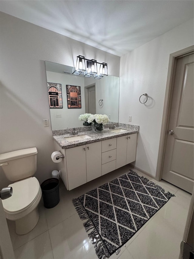 3237 Zircon Dr, Edinburg, TX 78541 - bathroom featuring double vanity and tile patterned floors