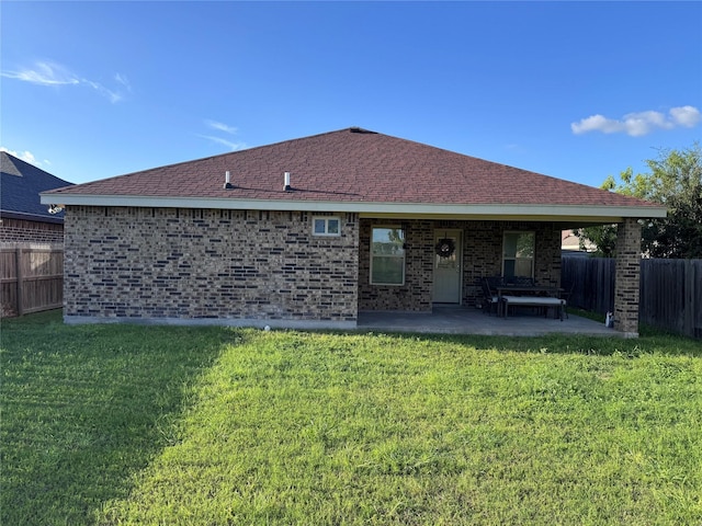 3237 Zircon Dr, Edinburg, TX 78541 - back of property with a patio area, brick siding, and a shingled roof