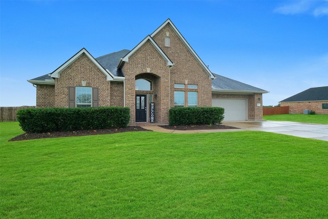 7518 Tejas Lakes Trl, Needville, TX 77461 - traditional-style house featuring brick siding, driveway, a garage, and a shingled roof