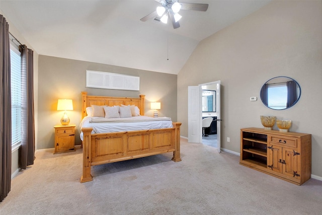 7518 Tejas Lakes Trl, Needville, TX 77461 - bedroom with light colored carpet, multiple windows, vaulted ceiling, and ceiling fan