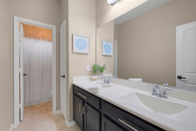 7518 Tejas Lakes Trl, Needville, TX 77461 - bathroom with double vanity and tile patterned floors