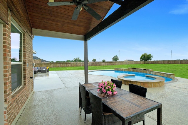 7518 Tejas Lakes Trl, Needville, TX 77461 - fenced backyard featuring a patio, a ceiling fan, and a pool with connected hot tub