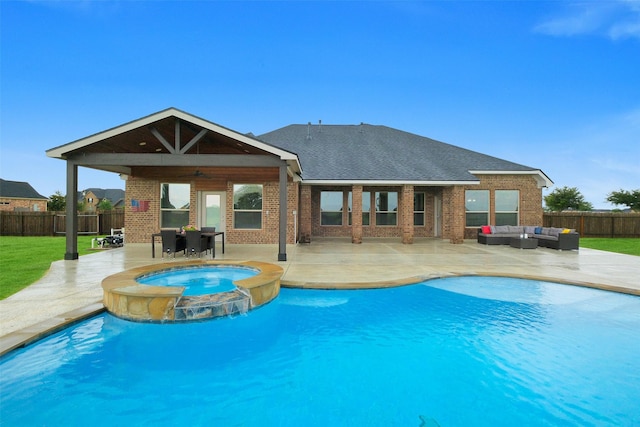 7518 Tejas Lakes Trl, Needville, TX 77461 - view of pool featuring an outdoor living space, a fenced backyard, a patio, and a pool with connected hot tub