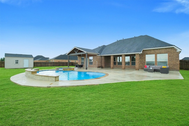 7518 Tejas Lakes Trl, Needville, TX 77461 - view of swimming pool with an outdoor living space, a fenced backyard, a patio, a pool with connected hot tub, and a shed