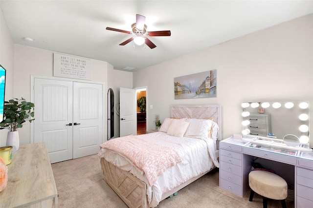 7518 Tejas Lakes Trl, Needville, TX 77461 - bedroom with light colored carpet, a closet, a ceiling fan, and a desk