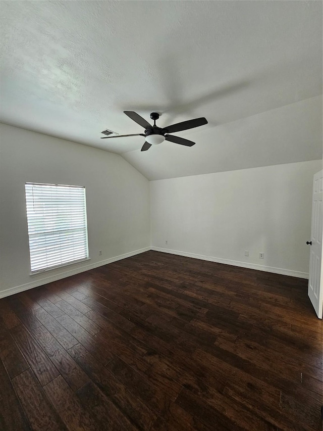 9207 Dairy View Ln, Houston, TX 77099 - spare room featuring vaulted ceiling, dark wood finished floors, and ceiling fan
