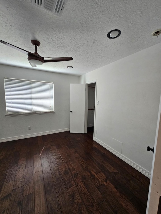9207 Dairy View Ln, Houston, TX 77099 - unfurnished room with hardwood / wood-style floors, a textured ceiling, and a ceiling fan
