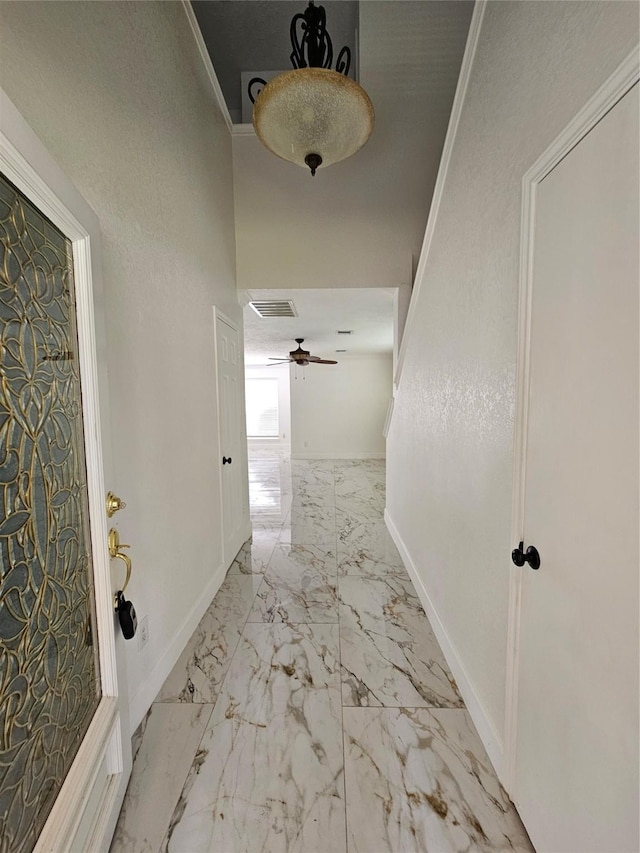 9207 Dairy View Ln, Houston, TX 77099 - hallway featuring marble finish floors and crown molding