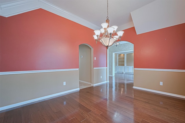 14610 Sandler Ct, Cypress, TX 77429 - empty room featuring arched walkways, wood finished floors, a chandelier, and crown molding