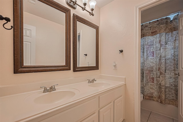14610 Sandler Ct, Cypress, TX 77429 - bathroom featuring double vanity and tile patterned flooring