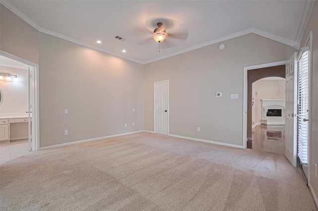 14610 Sandler Ct, Cypress, TX 77429 - unfurnished bedroom featuring light carpet, arched walkways, crown molding, ensuite bath, and recessed lighting