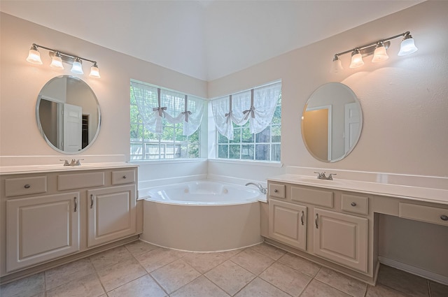 14610 Sandler Ct, Cypress, TX 77429 - full bathroom featuring two vanities, a garden tub, and tile patterned floors