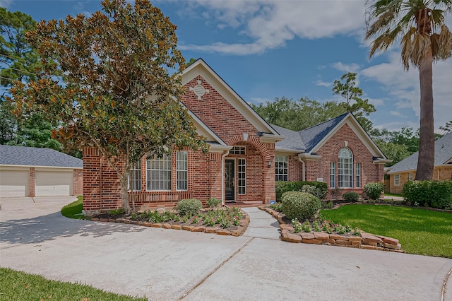 14610 Sandler Ct, Cypress, TX 77429 - view of front of house featuring brick siding, a front lawn, and an outdoor structure