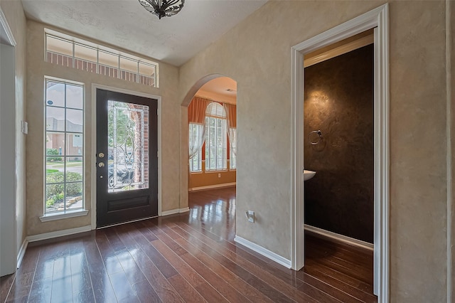 14610 Sandler Ct, Cypress, TX 77429 - entryway with arched walkways and dark wood finished floors