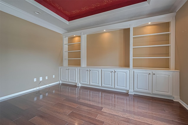 14610 Sandler Ct, Cypress, TX 77429 - unfurnished room featuring built in shelves, ornamental molding, dark wood-type flooring, a raised ceiling, and recessed lighting