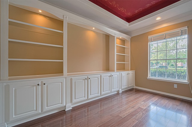14610 Sandler Ct, Cypress, TX 77429 - spare room with wood finished floors, ornamental molding, and built in features
