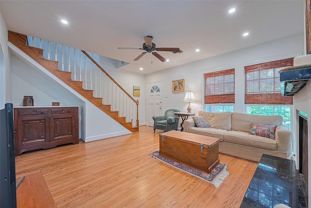 501 Gale St, Houston, TX 77009 - living room featuring light wood-style flooring, a ceiling fan, stairway, and recessed lighting