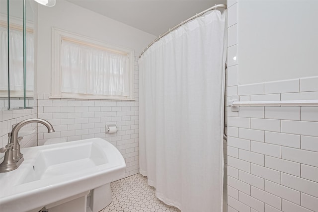 501 Gale St, Houston, TX 77009 - bathroom with tile walls, tile patterned flooring, a shower with curtain, and wainscoting