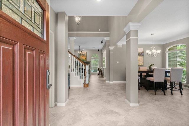 23 Sparklewood Pl, The Woodlands, TX 77381 - foyer entrance with plenty of natural light, a chandelier, stairway, crown molding, and decorative columns