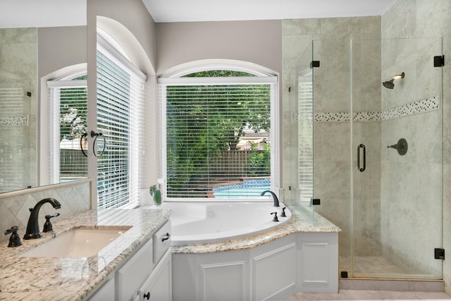 23 Sparklewood Pl, The Woodlands, TX 77381 - bathroom featuring vanity, a garden tub, and a shower stall