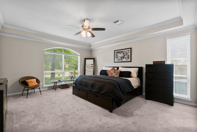 23 Sparklewood Pl, The Woodlands, TX 77381 - carpeted bedroom featuring crown molding, a ceiling fan, and a raised ceiling
