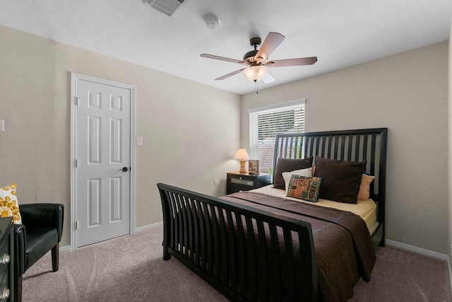 23 Sparklewood Pl, The Woodlands, TX 77381 - carpeted bedroom with baseboards and ceiling fan