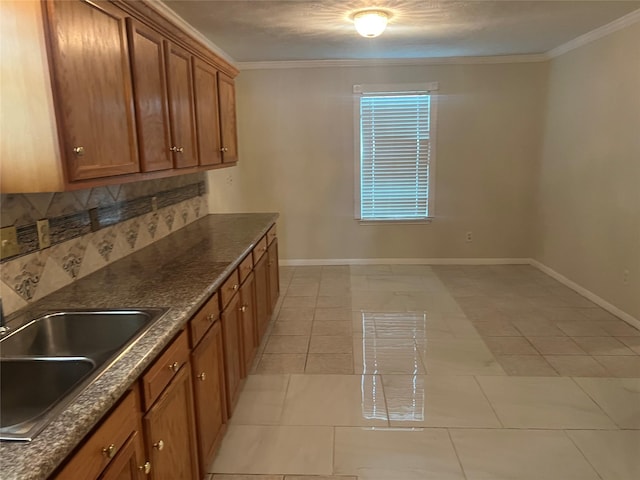 7001 Kassarine Pass, Houston, TX 77033 - kitchen featuring brown cabinets, crown molding, light tile patterned floors, and decorative backsplash