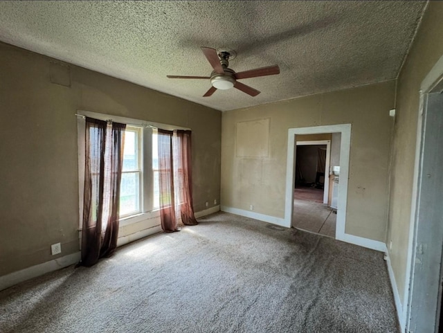 3215 Illinois St, Baytown, TX 77520 - unfurnished bedroom featuring carpet floors, a textured ceiling, and ceiling fan