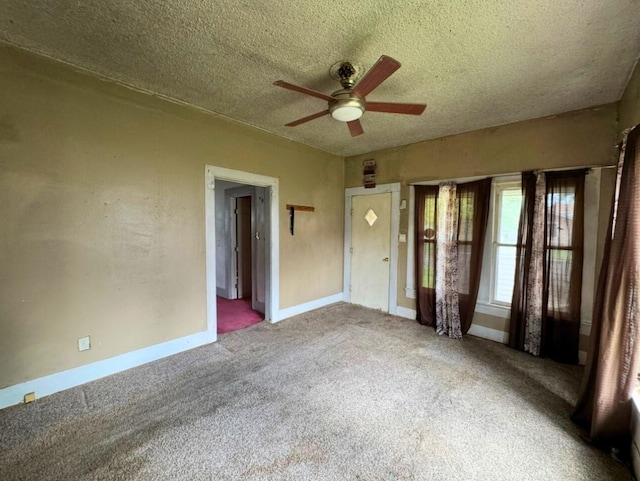 3215 Illinois St, Baytown, TX 77520 - unfurnished room with ceiling fan, carpet, and a textured ceiling