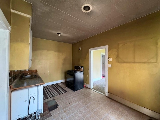 3215 Illinois St, Baytown, TX 77520 - kitchen with black range and a wood stove