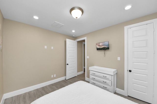 203 Pinedale Ave, Arcola, TX 77583 - bedroom featuring wood finished floors and recessed lighting