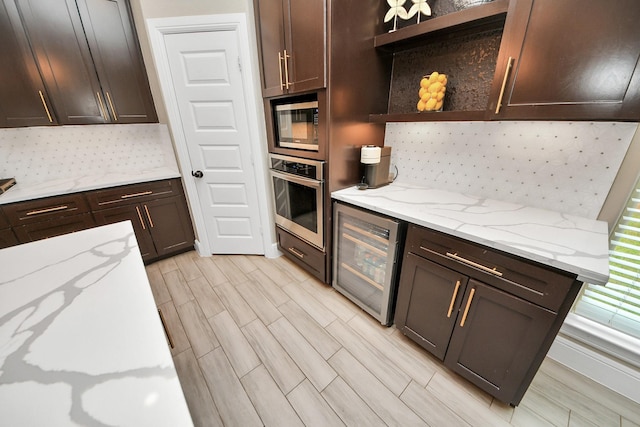 203 Pinedale Ave, Arcola, TX 77583 - kitchen featuring open shelves, appliances with stainless steel finishes, beverage cooler, tasteful backsplash, and dark brown cabinets
