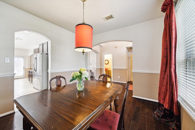 6111 Branch Lake Dr, Houston, TX 77066 - dining room featuring arched walkways and hardwood / wood-style flooring