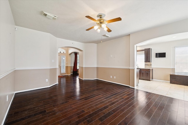 6111 Branch Lake Dr, Houston, TX 77066 - unfurnished room with arched walkways, a ceiling fan, and light wood finished floors