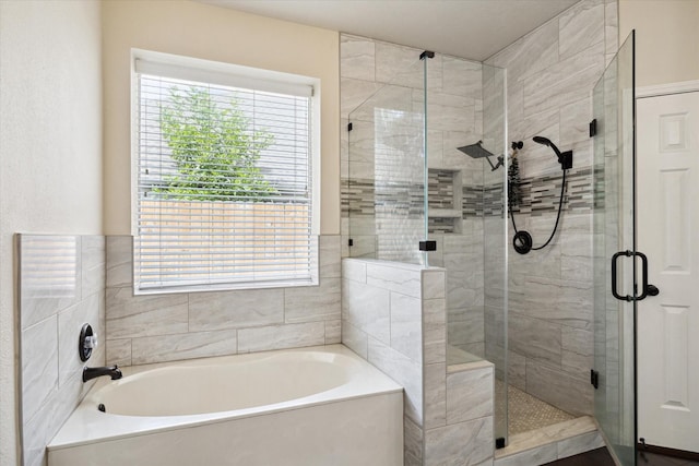 6111 Branch Lake Dr, Houston, TX 77066 - bathroom featuring a bath and a stall shower