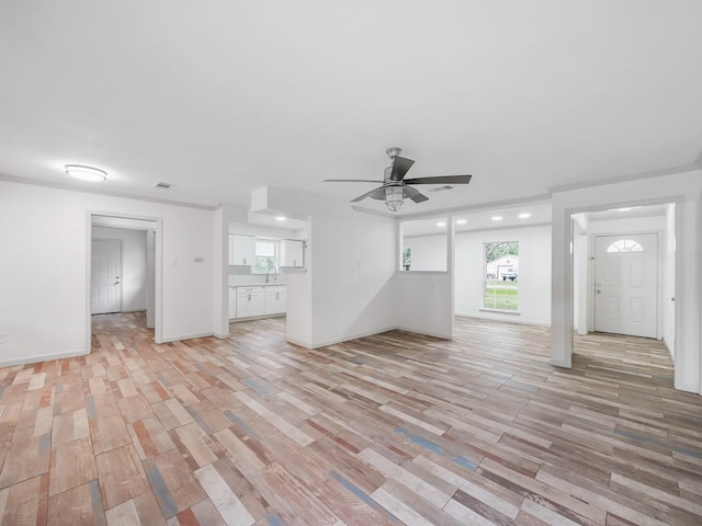 5010 Riverview Dr, Alvin, TX 77511 - unfurnished living room with light wood finished floors, ceiling fan, and recessed lighting