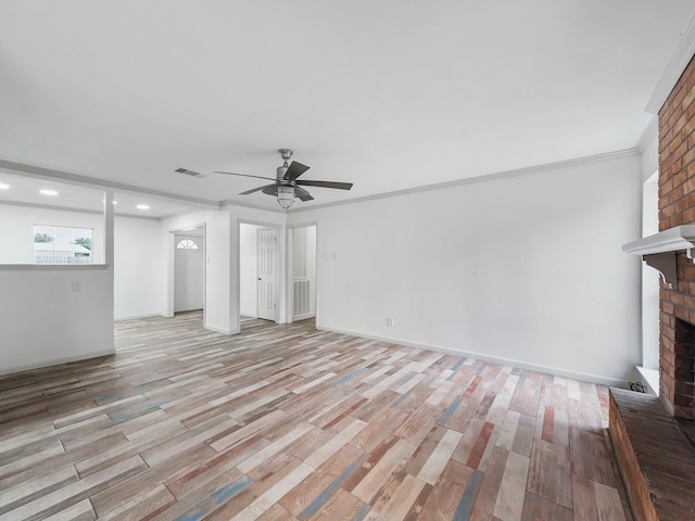 5010 Riverview Dr, Alvin, TX 77511 - unfurnished living room with a fireplace, light wood-style floors, recessed lighting, ceiling fan, and crown molding