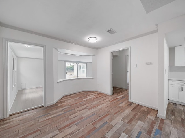 5010 Riverview Dr, Alvin, TX 77511 - empty room featuring light wood-style flooring and ornamental molding