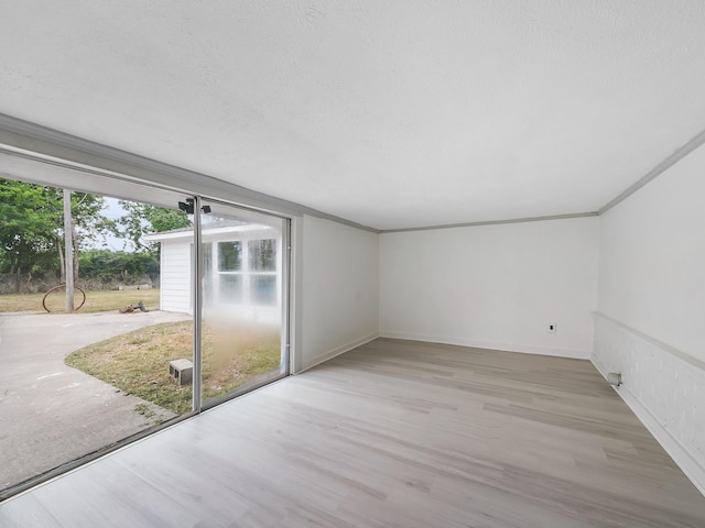 5010 Riverview Dr, Alvin, TX 77511 - spare room featuring wood finished floors and crown molding