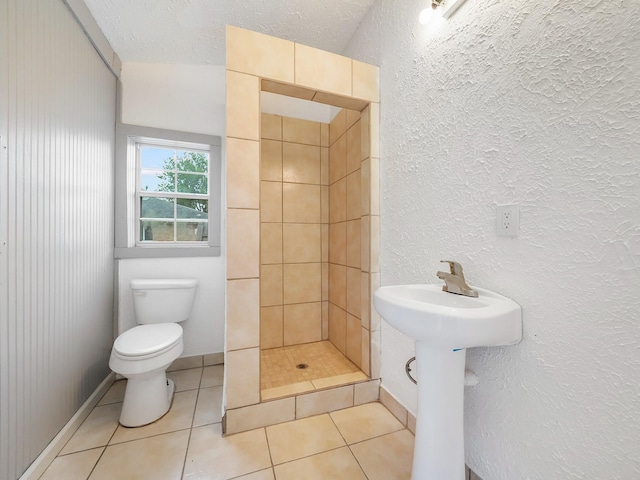 5010 Riverview Dr, Alvin, TX 77511 - full bath with a shower stall, a textured wall, and tile patterned flooring